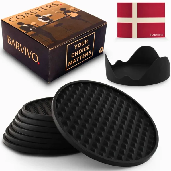 A collection of black rubber coasters displayed with a box.