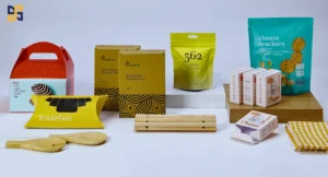 A variety of custom packaging designs, including gable boxes, rice boxes, snack pouches, cheese cracker bags, and chicken broth cartons displayed on a clean surface.