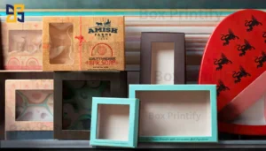 A collection of various decorative boxes in different sizes and colors, including a box featuring the label "AMISH FARMS" for handmade bar soap, a turquoise box, and a red circular box with a lion design.